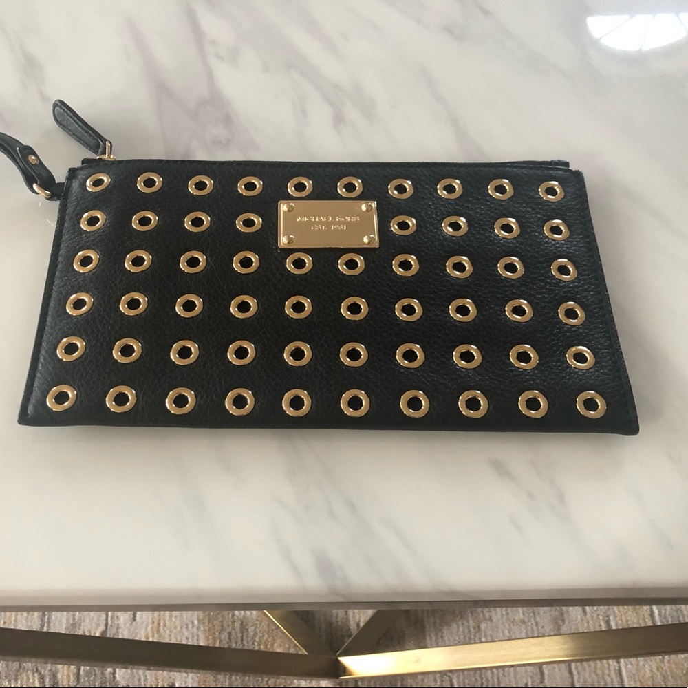 Michael Kors leather and grommet wristlet
